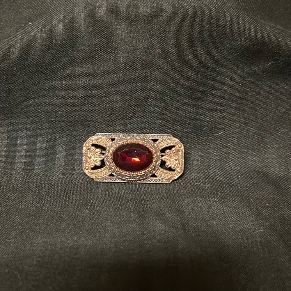 Brooch.